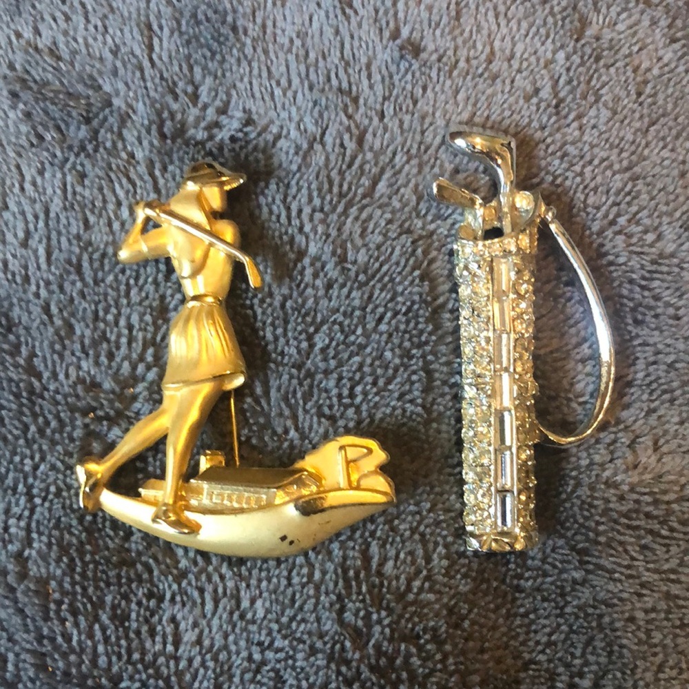 Lady golfer brooches. One gold tone and one rhinestone golf bag. Very pretty